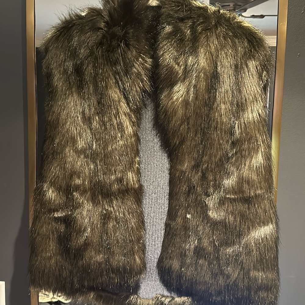 Faux Fur Brown/Gray Reversible vest. No sizing or tag but fits like a Medium